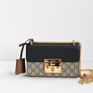 Gucci Elegant Black and Brown Crossbody Bag with Gold Accents
